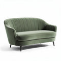 Green velvet loveseat with curved back and tapered legs 150 x 75 x 90cm